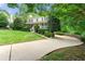 Charming home featuring a curved driveway and meticulously maintained landscaping at 706 Briarleigh Sw Ct, Mableton, GA 30126