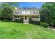 Inviting two-story home with a covered porch, manicured lawn, and well-maintained landscaping at 706 Briarleigh Sw Ct, Mableton, GA 30126