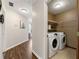 Laundry room with washer, dryer, and shelving for storage and organization at 706 Briarleigh Sw Ct, Mableton, GA 30126