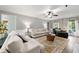 Spacious living room with natural light, neutral furniture, and hardwood floors at 706 Briarleigh Sw Ct, Mableton, GA 30126