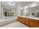 Large main bathroom with skylight, tub, double sinks, and ample counter space at 706 Briarleigh Sw Ct, Mableton, GA 30126