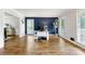 Bright home office with accent wall, wood floors, and multiple windows at 706 Briarleigh Sw Ct, Mableton, GA 30126