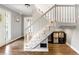 Bright foyer featuring a staircase with white railings and wood flooring at 706 Briarleigh Sw Ct, Mableton, GA 30126