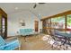 Inviting screened porch with rustic wood trim, furniture, and a backyard view at 205 Corinth Ct, Roswell, GA 30075