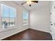 Well-lit bedroom features two large windows, hardwood floors, and neutral walls at 4325 Water Elm Aly, Doraville, GA 30360