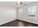 Bright bedroom features two large windows, hardwood floors, ceiling fan, and neutral walls at 4325 Water Elm Aly, Doraville, GA 30360