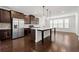 Modern kitchen boasts stainless steel appliances, an island with a sink, and dark wood cabinetry at 4325 Water Elm Aly, Doraville, GA 30360