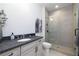 Modern bathroom with walk-in shower, sleek vanity, and elegant fixtures at 301 Sobeck Way, Canton, GA 30115