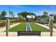 Bocce court featuring a well-maintained lawn, seating, and attractive landscaping at 301 Sobeck Way, Canton, GA 30115