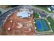 Aerial view of a community construction site with tennis courts and the foundation of a pool and clubhouse at 301 Sobeck Way, Canton, GA 30115