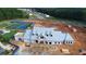 Aerial view of the construction of a community center featuring a tennis court and clubhouse at 301 Sobeck Way, Canton, GA 30115
