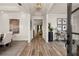 Inviting foyer with hardwood floors leads to dining room and study with modern decor at 301 Sobeck Way, Canton, GA 30115