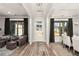 Bright open-concept foyer with hardwood floors and views of multiple rooms at 301 Sobeck Way, Canton, GA 30115