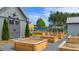 Charming community garden with raised beds, a garden shed, and gravel pathways at 301 Sobeck Way, Canton, GA 30115