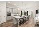 Spacious kitchen with large island, pendant lighting, and modern appliances at 301 Sobeck Way, Canton, GA 30115