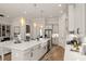 Open kitchen with large island, stainless appliances, and seamless flow to living area at 301 Sobeck Way, Canton, GA 30115