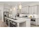 Bright, spacious kitchen with stainless steel appliances and white countertops at 301 Sobeck Way, Canton, GA 30115