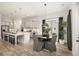 Open-concept kitchen and dining area with an island, modern appliances, and stylish décor at 301 Sobeck Way, Canton, GA 30115
