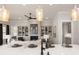 Open-concept view of living room featuring built-ins and a fireplace from kitchen island at 301 Sobeck Way, Canton, GA 30115