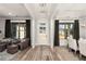 Inviting living room featuring hardwood floors, neutral walls, and a well-lit seating area at 301 Sobeck Way, Canton, GA 30115