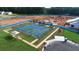 Aerial view of finished neighborhood tennis courts with manicured landscaping and convenient walkway access at 301 Sobeck Way, Canton, GA 30115