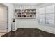 Charming bedroom with hardwood floors, built-in bookshelves, plantation shutters and neutral decor at 2660 Peachtree Nw Rd # 4G, Atlanta, GA 30305