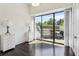 Spacious bedroom with hardwood floors and a large glass door leading to a terrace at 2660 Peachtree Nw Rd # 4G, Atlanta, GA 30305