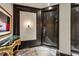 Elegant entry with patterned marble floors and striking dark wood door design at 2660 Peachtree Nw Rd # 4G, Atlanta, GA 30305
