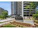 Luxury condo building, Park Place on Peachtree, with manicured lawn and colorful flowers at 2660 Peachtree Nw Rd # 4G, Atlanta, GA 30305