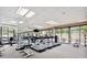 Well-equipped gym with treadmills, weights, and windows offering a view at 2660 Peachtree Nw Rd # 4G, Atlanta, GA 30305