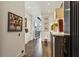 Inviting hallway features hardwood floors, art, and elegant decor at 2660 Peachtree Nw Rd # 4G, Atlanta, GA 30305