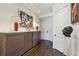 Sophisticated hallway with hardwood floors, cabinet, and art at 2660 Peachtree Nw Rd # 4G, Atlanta, GA 30305
