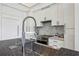 Close up view of a modern kitchen with sleek white cabinetry at 2660 Peachtree Nw Rd # 4G, Atlanta, GA 30305