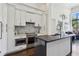 Modern kitchen with sleek white cabinets and stainless steel appliances at 2660 Peachtree Nw Rd # 4G, Atlanta, GA 30305