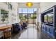 Bright living room with hardwood floors, large windows, and stylish blue sofa at 2660 Peachtree Nw Rd # 4G, Atlanta, GA 30305