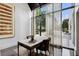 Home office space featuring oversized window and natural light with a modern desk and seating at 2660 Peachtree Nw Rd # 4G, Atlanta, GA 30305