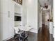 Office area featuring a white table with chairs, with white cabinets and a flat screen TV at 2660 Peachtree Nw Rd # 4G, Atlanta, GA 30305
