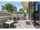 Outdoor patio with brick pavers, decorative wall, and comfortable seating area at 2660 Peachtree Nw Rd # 4G, Atlanta, GA 30305