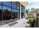 Private patio with a seating area, stone floor and large windows to the interior living spaces at 2660 Peachtree Nw Rd # 4G, Atlanta, GA 30305