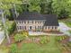 Beautiful aerial shot of a brick home with manicured lawn and natural surroundings at 4979 Shadow Glen Ct, Dunwoody, GA 30338