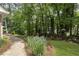 Backyard walkway along beautiful landscaping at 4979 Shadow Glen Ct, Dunwoody, GA 30338