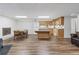 Finished basement with kitchen featuring wood cabinets, dining area, and a brick fireplace at 4979 Shadow Glen Ct, Dunwoody, GA 30338