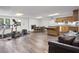 Finished basement with exercise area, dining area, and kitchen with wood cabinets and a leather couch at 4979 Shadow Glen Ct, Dunwoody, GA 30338
