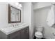 Modern bathroom with stylish vanity, marble countertop, and updated fixtures at 4979 Shadow Glen Ct, Dunwoody, GA 30338