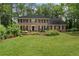 Traditional brick home with a well-maintained lawn and landscaping, creating a classic curb appeal at 4979 Shadow Glen Ct, Dunwoody, GA 30338