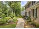 Charming brick home with a beautiful walkway and manicured landscaping, creating a welcoming entrance at 4979 Shadow Glen Ct, Dunwoody, GA 30338