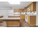 Cozy kitchen features wood cabinets, modern appliances, and ample counter space at 4979 Shadow Glen Ct, Dunwoody, GA 30338