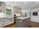 Well-lit kitchen with white cabinets, marble countertops, and stainless steel appliances at 4979 Shadow Glen Ct, Dunwoody, GA 30338