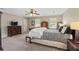 Spacious main bedroom offering generous light from large windows and complemented by neutral carpeting at 4979 Shadow Glen Ct, Dunwoody, GA 30338
