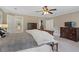 Spacious main bedroom showcasing carpet floors, access to the en suite bathroom, and walk-in closet at 4979 Shadow Glen Ct, Dunwoody, GA 30338